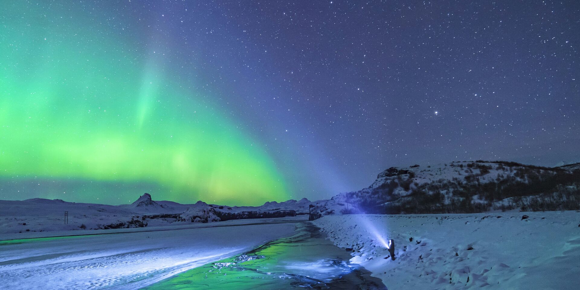 Northern lights over Iceland winter landscape
